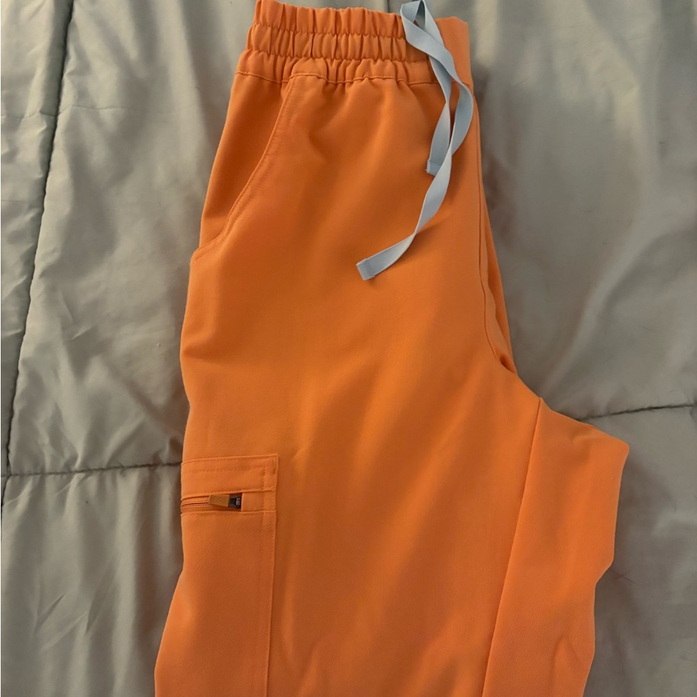 Shaka orange woman’s figs joggers